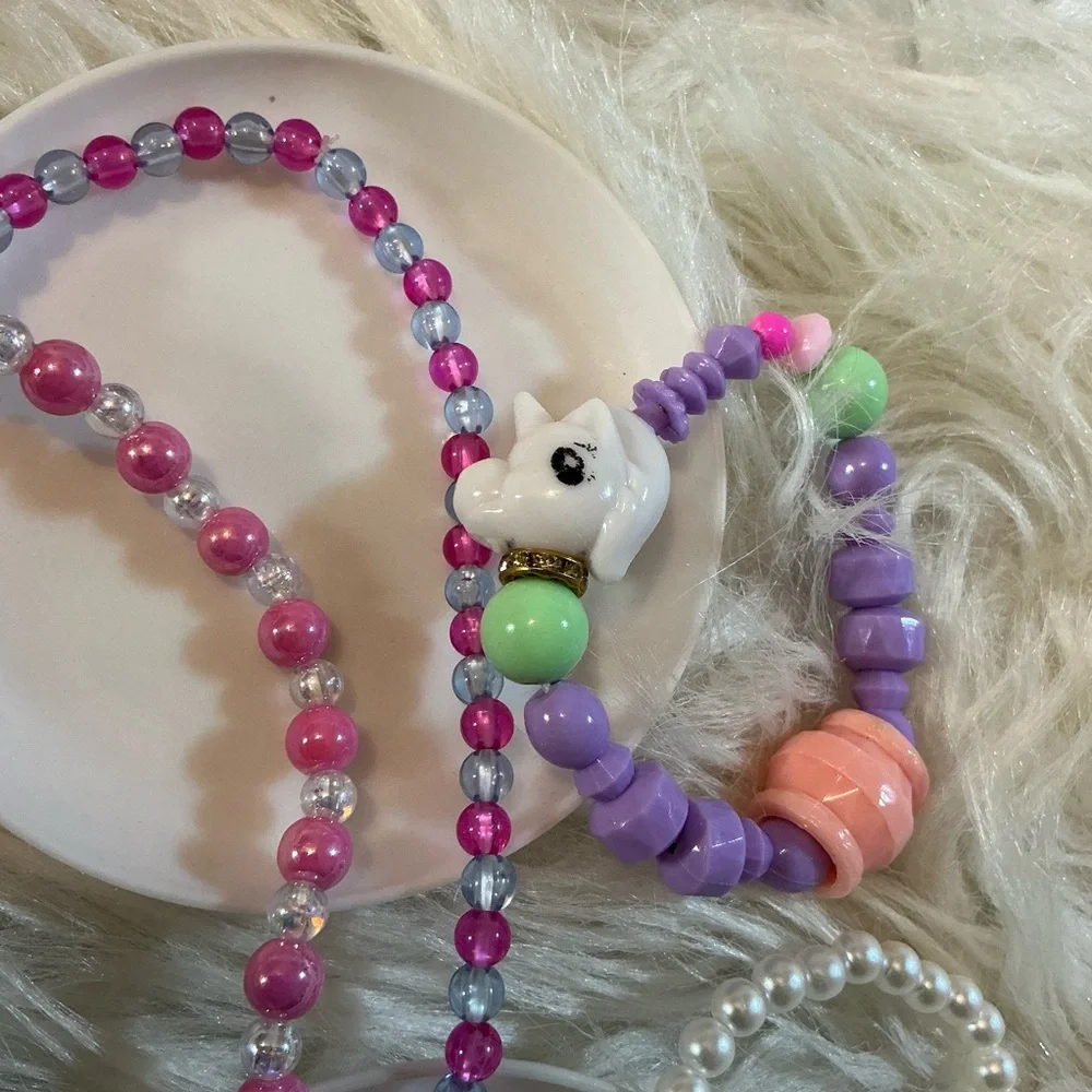 2 necklaces (one Dreamworks Trolls/Poppy) and 2 bracelets for children
